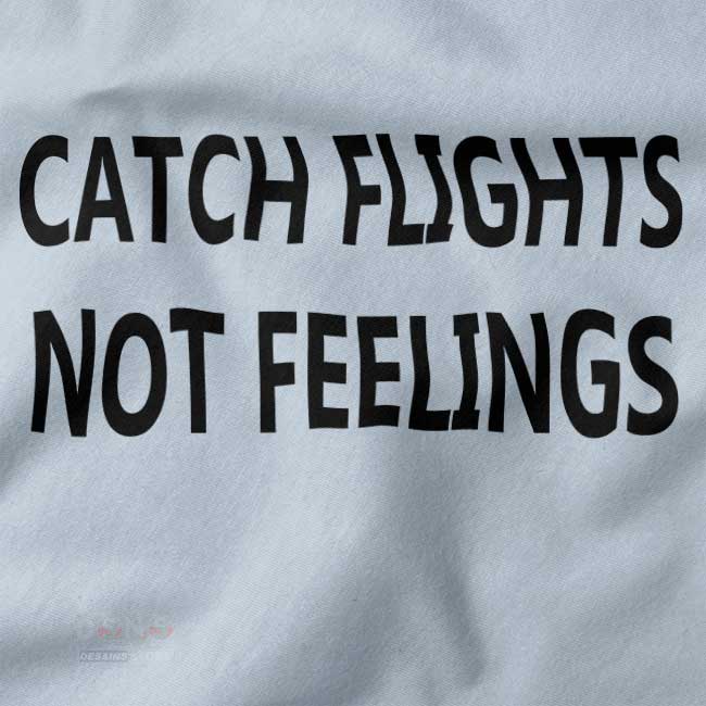 Graphic wanderlust T-shirt featuring Catch Flights Not Feelings text